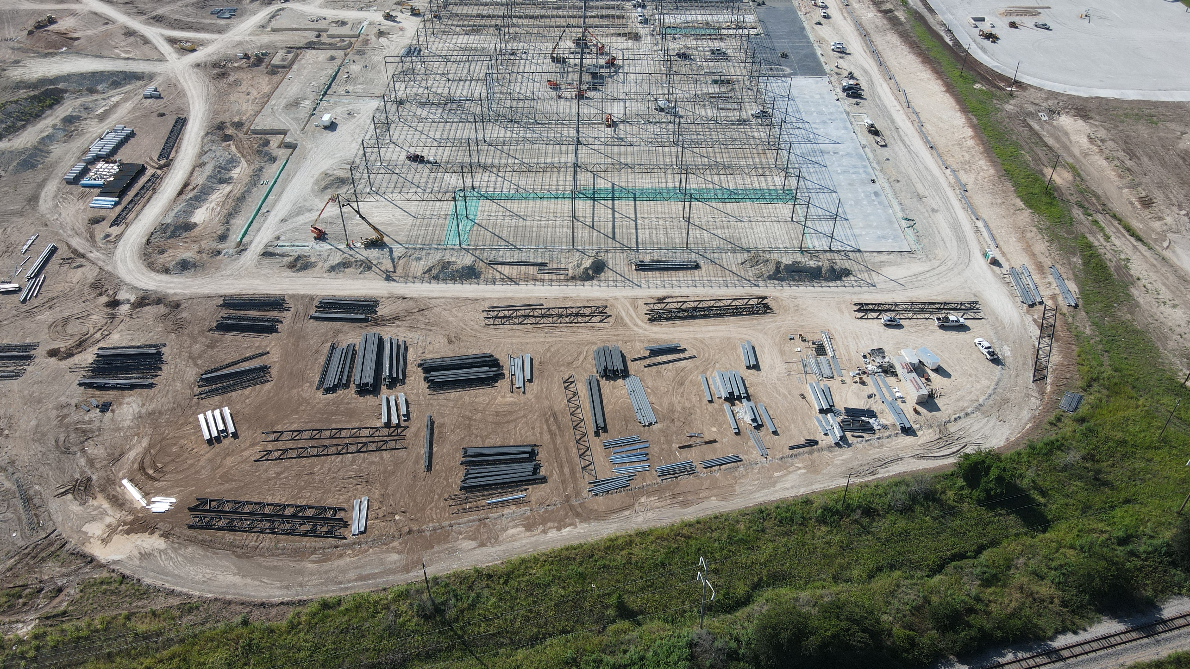 Active steel erection across the slab.