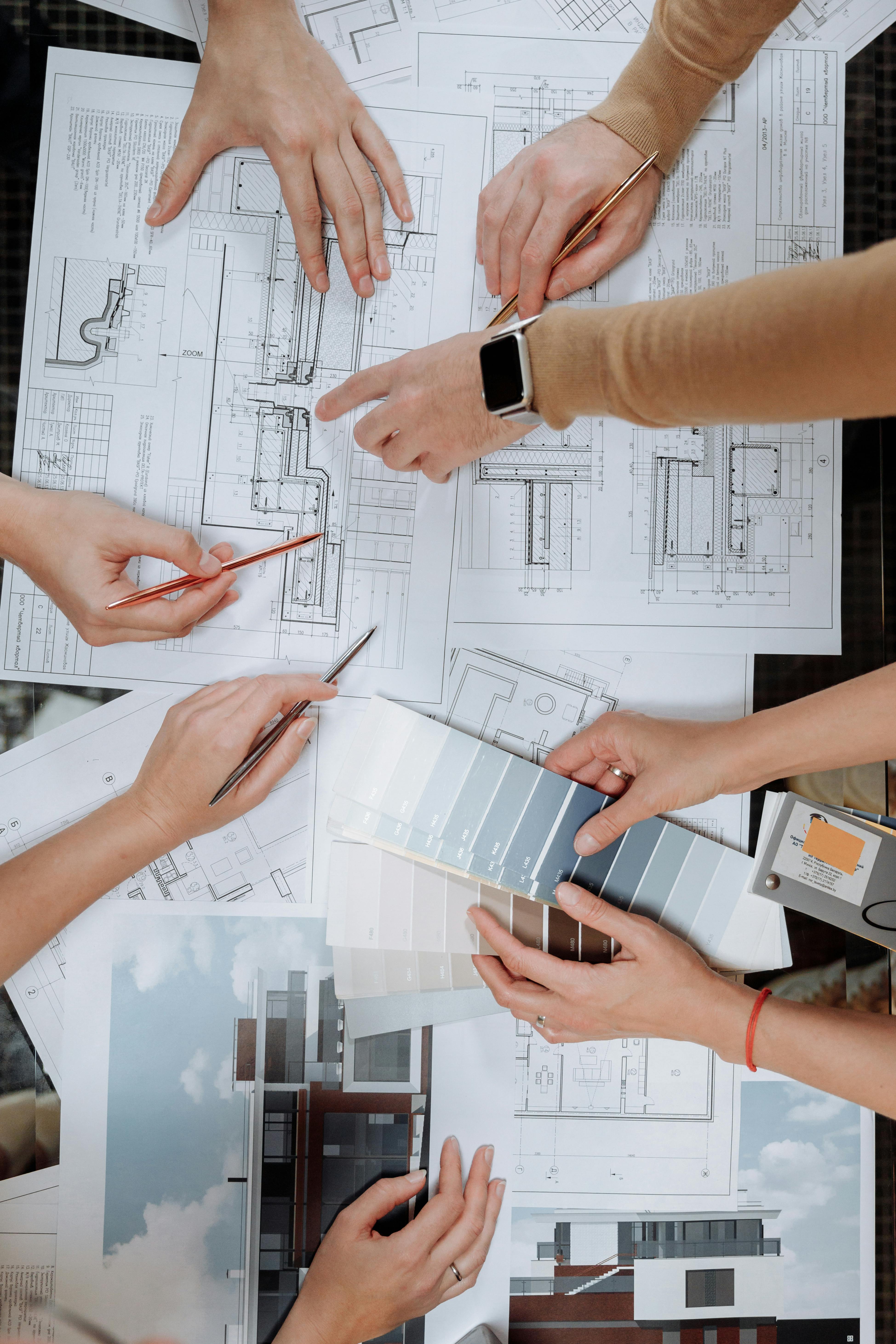 Team coordinating over blueprints