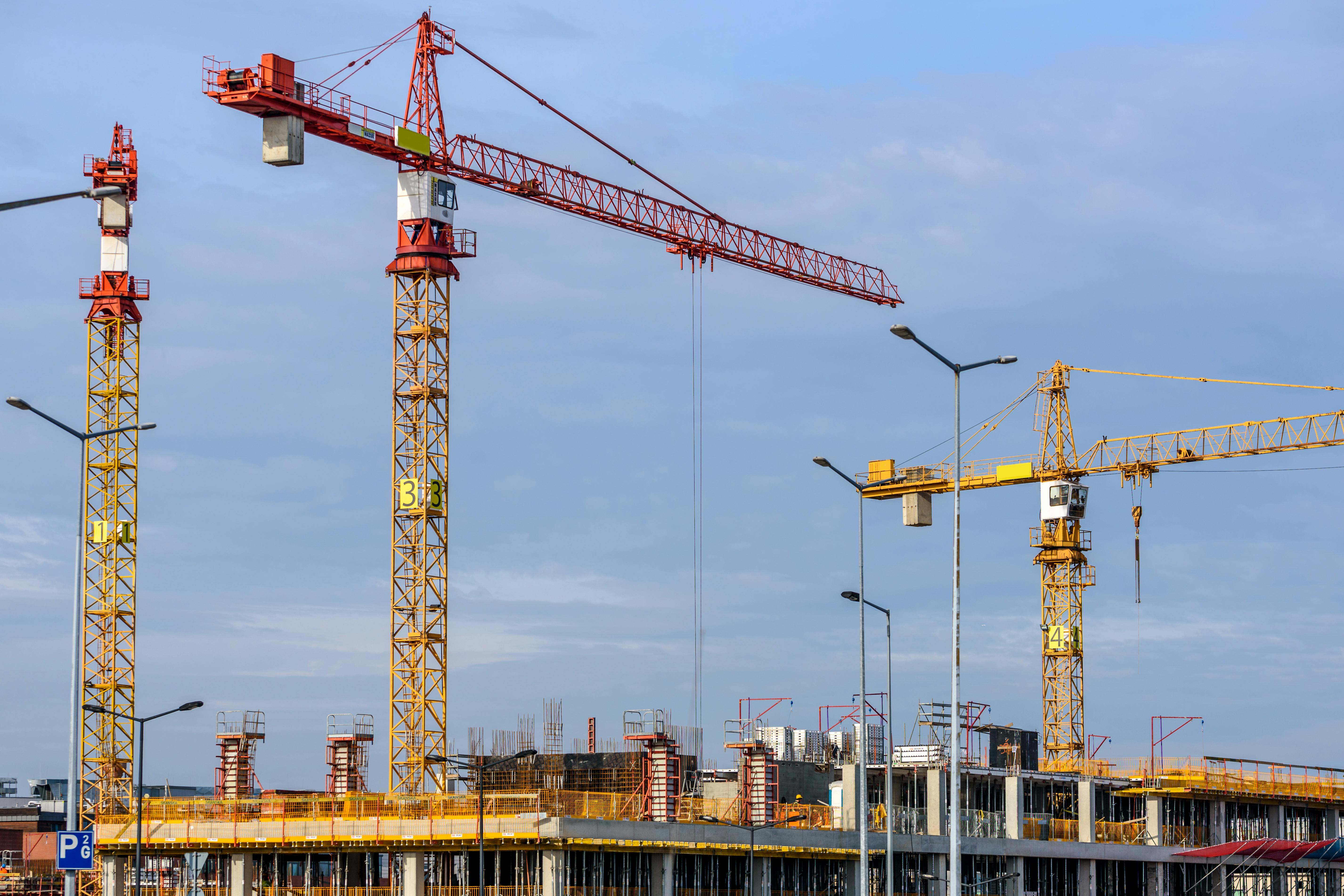 Construction cranes and industrial infrastructure site
